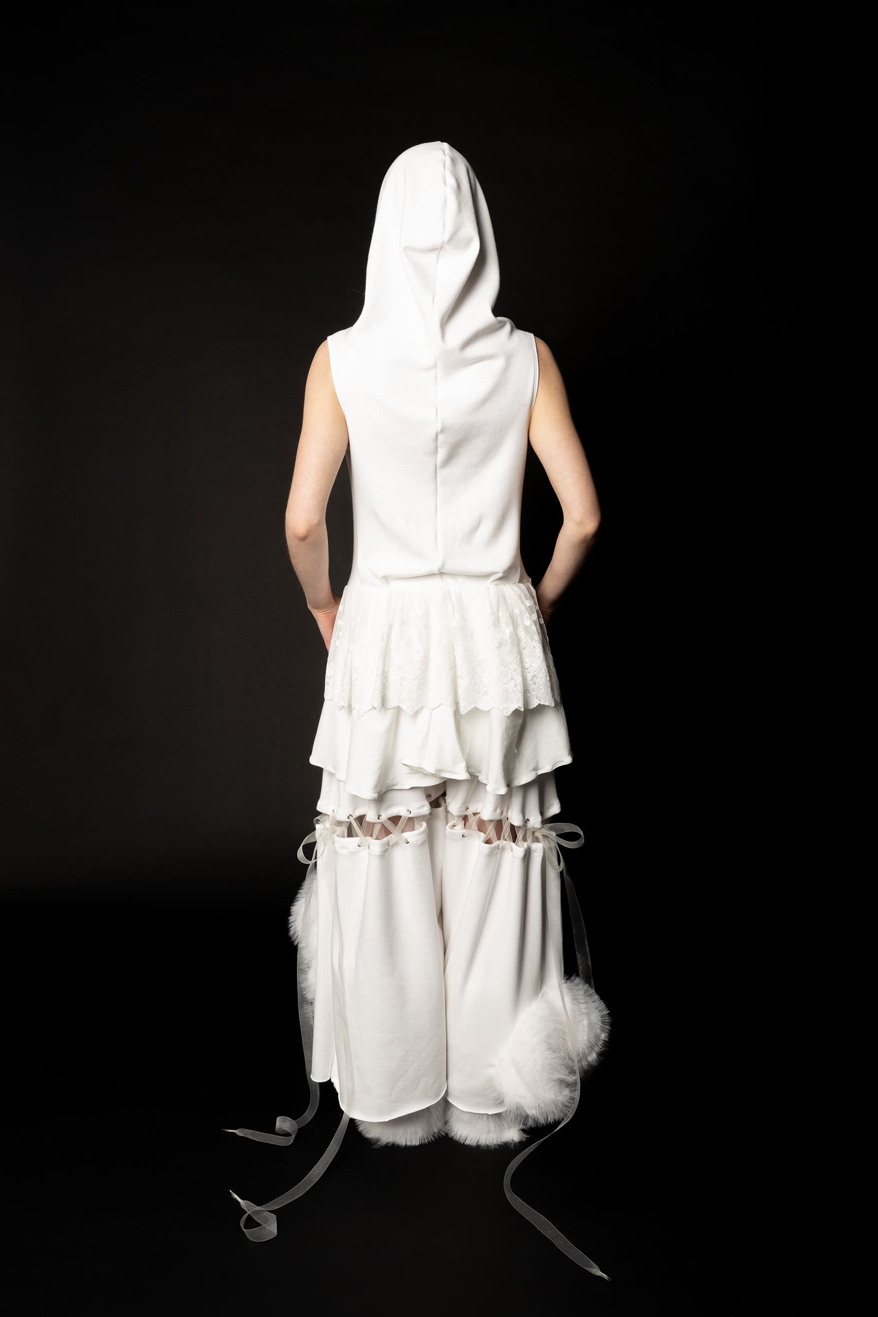 © 2026 Linh Chi Nguyen & Thanh Van Nguyen — The Running Bride: Back detail of hooded ruffle ensemble